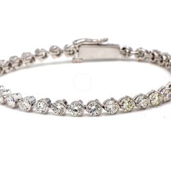 6.25' Tennis bracelet with half bezel set (38) round diamonds.  D5.09ct.t.w.