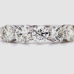 5-stone band in platinum with basket prong set round diamonds.  D1.51ct.t.w.  Size 5.5