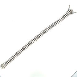 3-row Tennis bracelet with basket prong set round diamonds.  D6.83ct.t.w.
