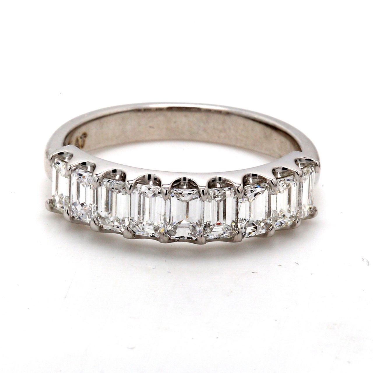 9-stone band in platinum with U-prong set emerald cut diamonds.  D1.24ct.t.w.  Size 6