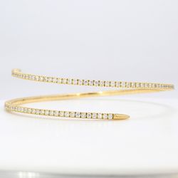 Flexible bangle in 18K YG with 4-prong set round diamonds.  D2.28ct.t.w.