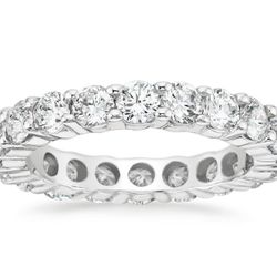 Eternity band with shared prong set (28) round diamonds.  D0.55ct.t.w.  Size 5