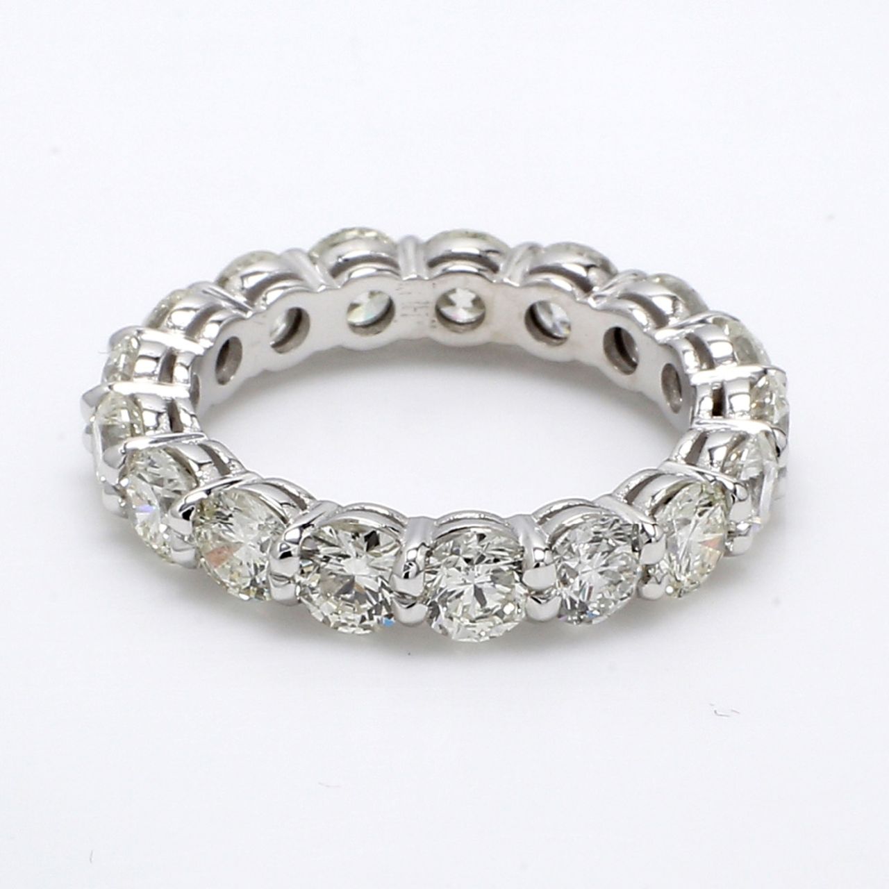 Eternity band with shared prong set (17) round diamonds.  D4.33ct.t.w.  Size 6.5