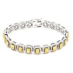 7' Tennis halo bracelet in 18K WG with french pave set rounds around prong set fancy intense yellow cushion cut diamond centers.  D9.94ct.t.w.  Fancy Intense Yellow 7.02ct.t.w.