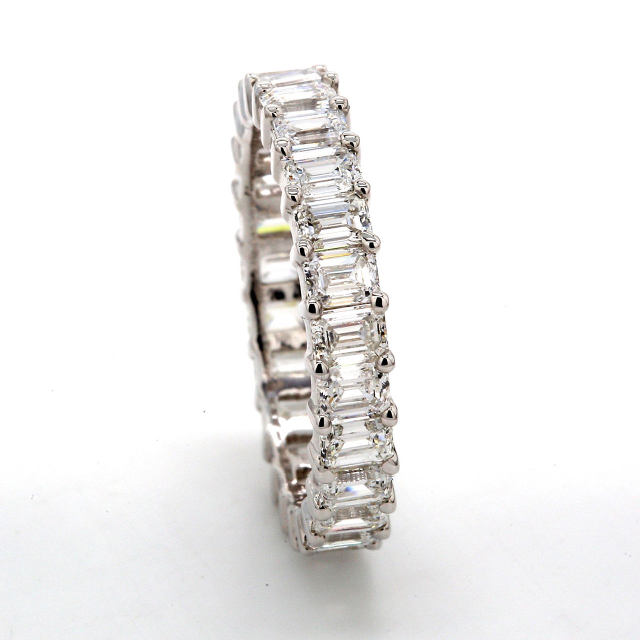 Eternity band with shared prong set (25) emerald cut diamonds.  D2.98ct.t.w.  Size 6