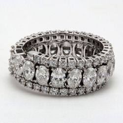 Flexible eternity tri-band style in 18K WG with prong set oval & round diamonds.  D4.58ct.t.w.