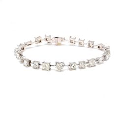 7' Tennis bracelet in platinum with alternating prong set assorted shape diamonds.  D8.63ct.t.w.
