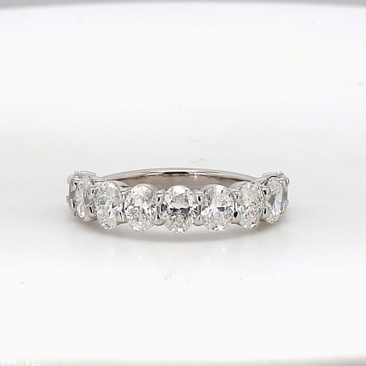 9-stone band in platinum with shared prong basket set oval diamonds.  D2.27ct.t.w.  Size 6