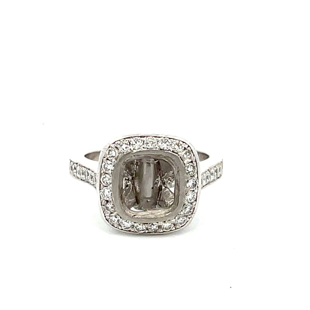 Halo semi-mount in platinum with pave and bezel set round diamonds.  D0.75ct.t.w.  Size 5.25