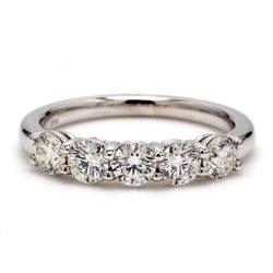 5-stone band with shared prong set round diamonds.  D1.01ct.t.w.
