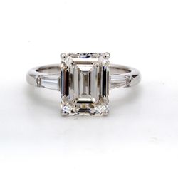 3-stone semi-mount with a pair of channel set tapered baguette diamond sides.  D0.36ct.t.w.  Size 4.5