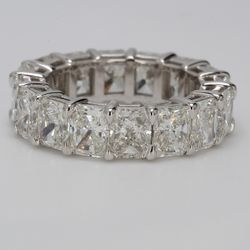 Eternity band in platinum with basket shared prong set G-H/VVS (16) radiant diamonds.  D8.75ct.t.w.  Size 5.75