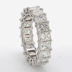 Eternity band in platinum w/ basket claw prong set (19) radiant cut diamonds.  D5.98ct.t.w.  Size 6.25