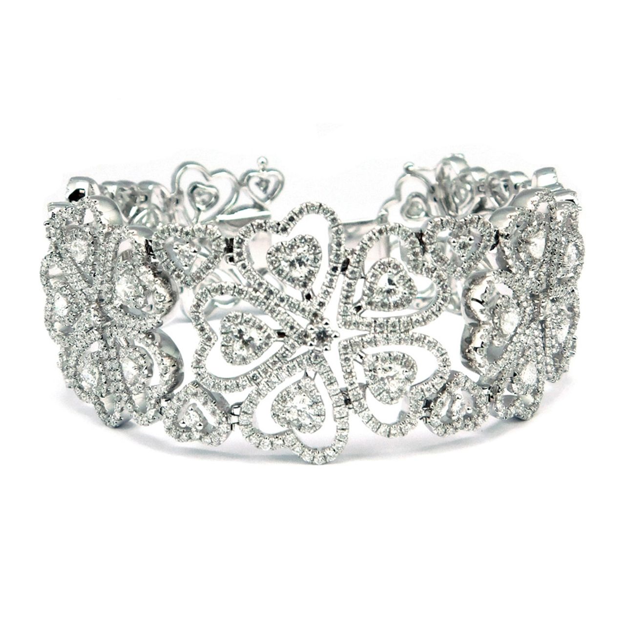 Designer bracelet with heart design in18K WG with prong and pave set round diamonds.  D13.73ct.t.w.