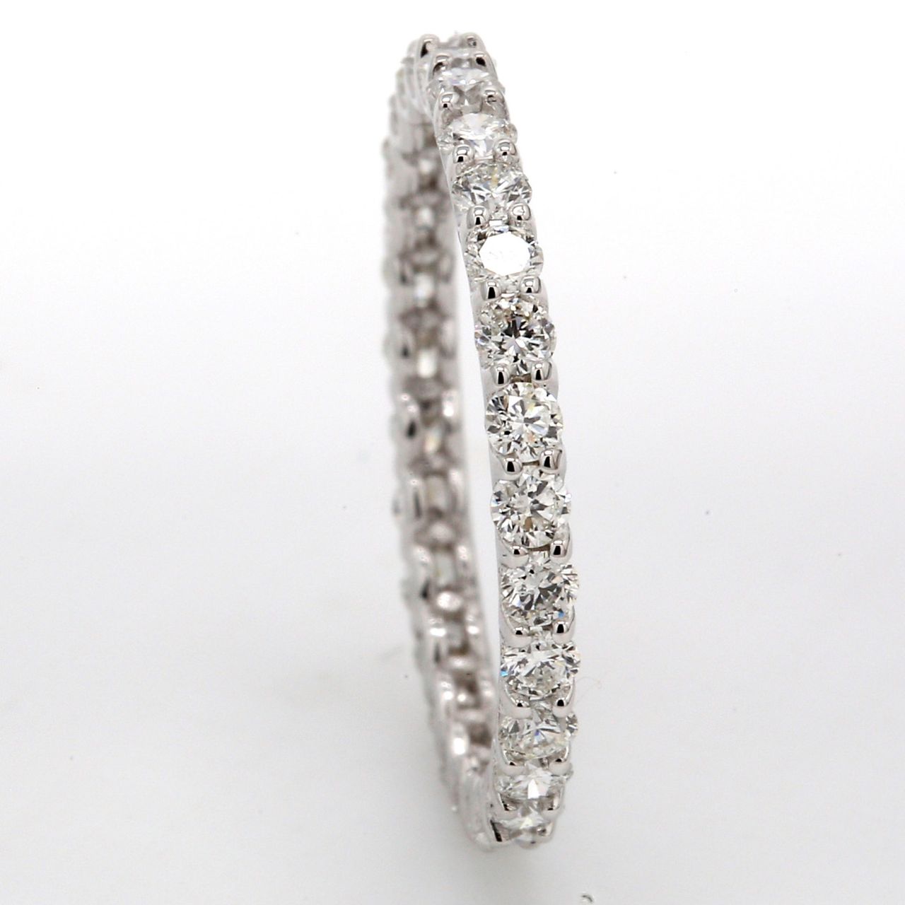 Eternity band in 18K WG with U-prong set (28) round diamonds.  D0.83ct.t.w.  Size 5