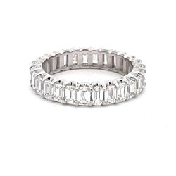 Eternity band in platinum with prong set (27) emerald cut diamonds.  D2.98ct.t.w.  Size 5.5