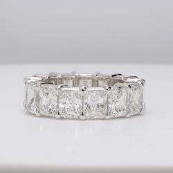 Eternity band in platinum with basket set G/VS1 (15) radiant cut diamonds.  D11.09ct.t.w.  Size 5.5