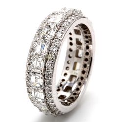 Eternity band in 18K WG with combination pave set round diamonds & side ways prong set (19) emerald cut diamonds.  D4.11ct.t.w.  Size 6.75