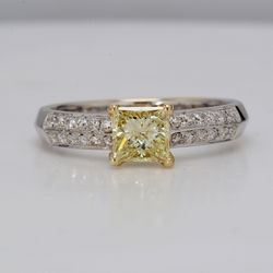 Ring in 18K 2-tone with prong set prong set GIA certified FLY/SI1 princess cut center and 2-row French Pave round diamonds along the shank.   D1.00ct.t.w.  (Center 0.71ct.)