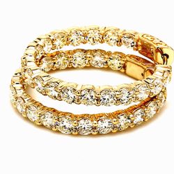 1.25' Inside out hoop earrings in yellow gold with shared prong set (36) round diamonds.  D6.91ct.t.w.