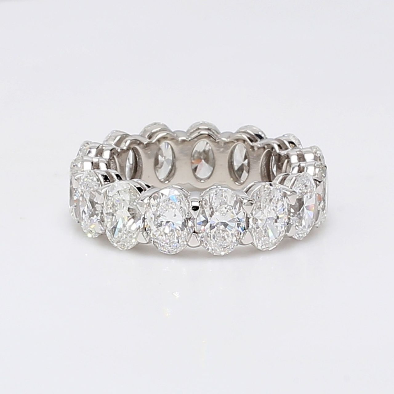 Eternity band in platinum with shared prong basket set D-F/SI (15) oval diamonds.  D7.89ct.t.w.  Size 6