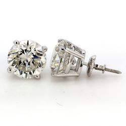 Stud earrings with 4-prong set USA certified G/SI3 round diamonds.  D6.39ct.t.w.