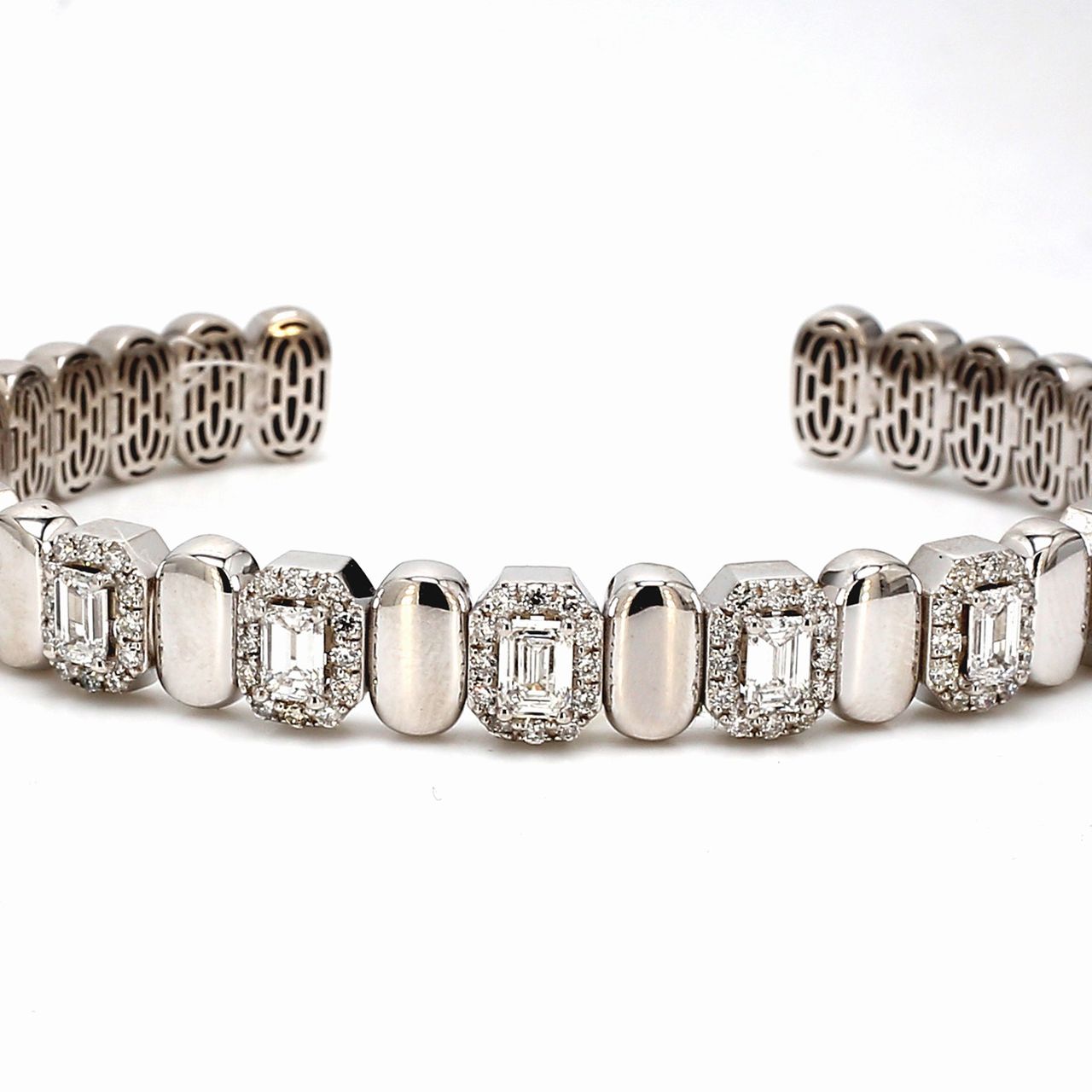 Halo open cuff bangle with alternation gold and 4-prong set (7) emerald cut diamonds.  D2.71ct. t.w.