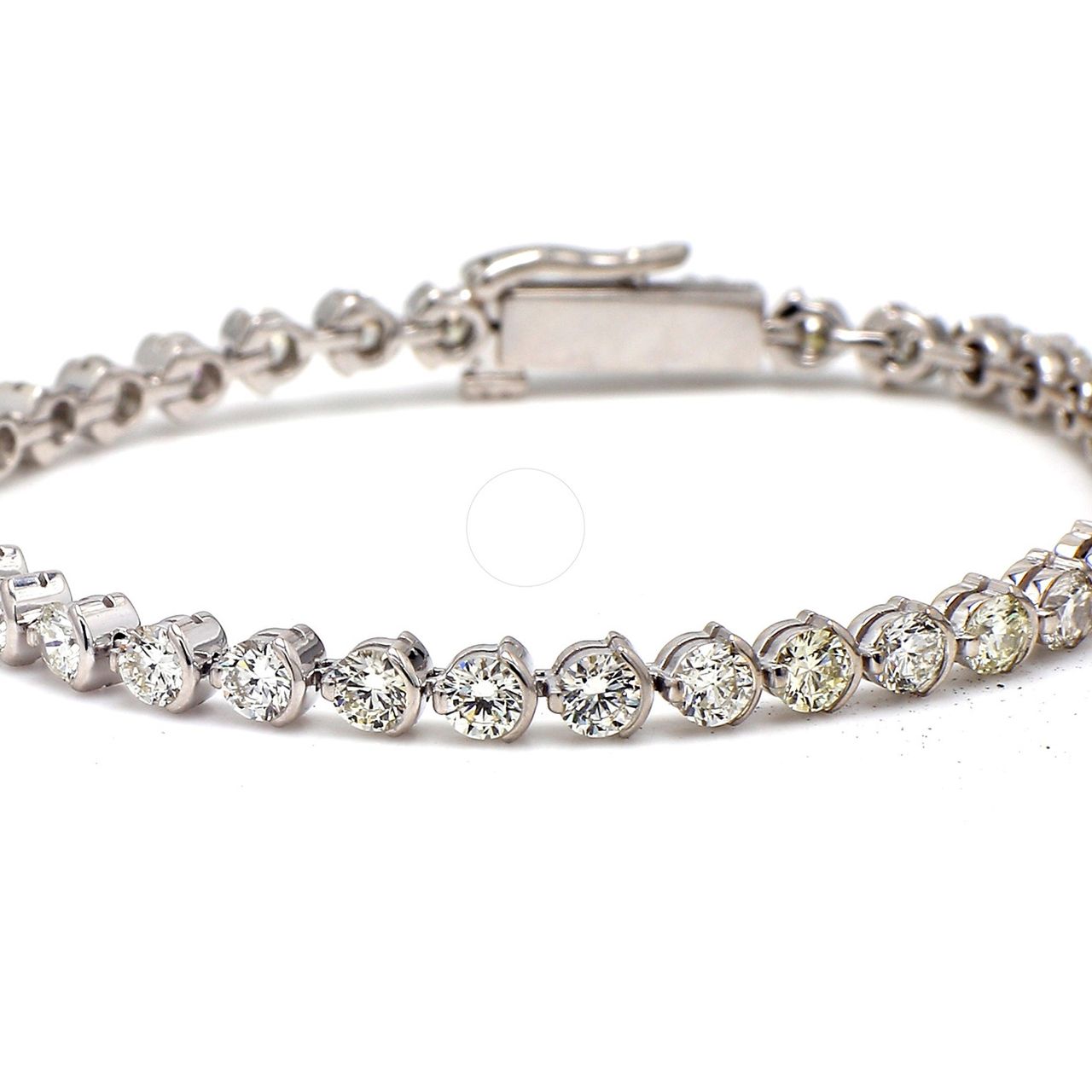 6.25' Tennis bracelet with half bezel set (38) round diamonds.  D5.09ct.t.w.