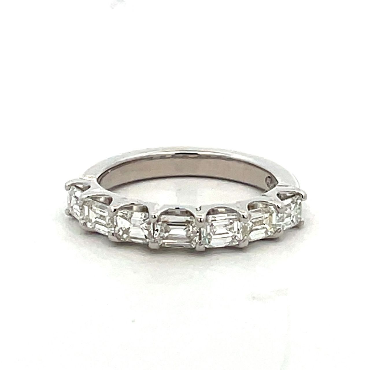 7-stone band east west style in platinum with prong set emerald cut diamonds.  D1.31ct.t.w.  Size 5.5