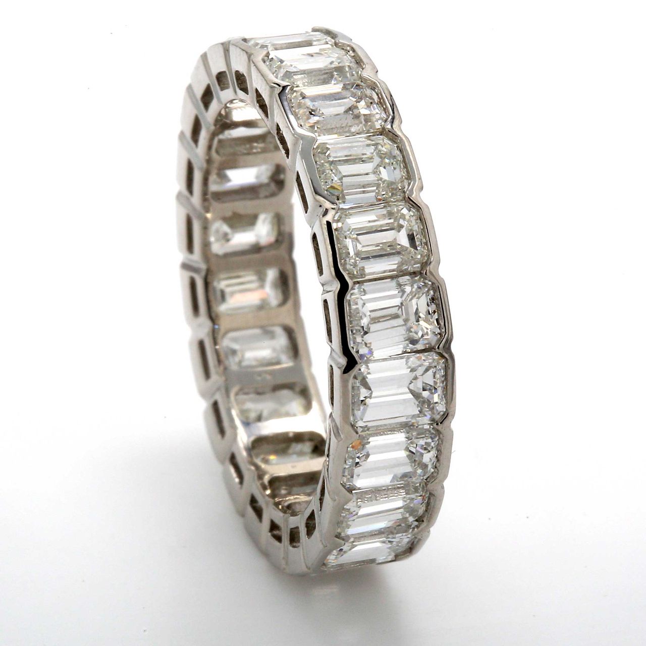Eternity band in platinum with channel set (22) emerald cut diamonds.  D5.22ct.t.w.  Size 6.75