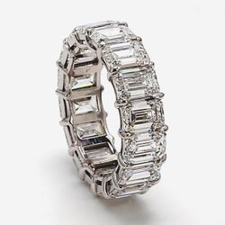 Eternity band in platinum w/ basket claw prong set GIA certified D-F/VVS2-VS2 (16) emerald cut diamonds.  D8.86ct.t.w.  Size 5.75