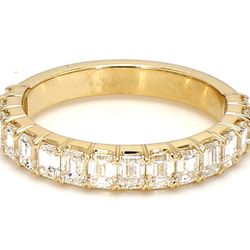 3/4 way band in yellow gold with prong set (16) emerald cut diamonds.  D1.38ct.t.w.  Size 4.75