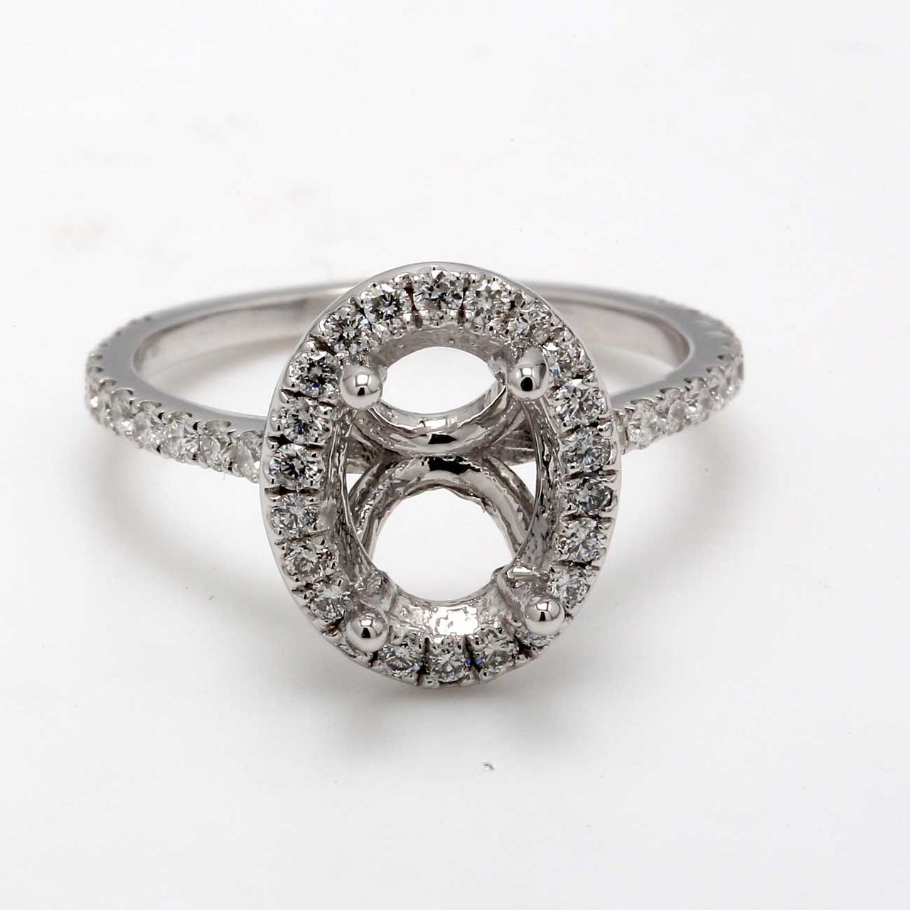 Halo semi-mount with U-prong set round diamonds.  D0.62ct.t.w.  Size 7