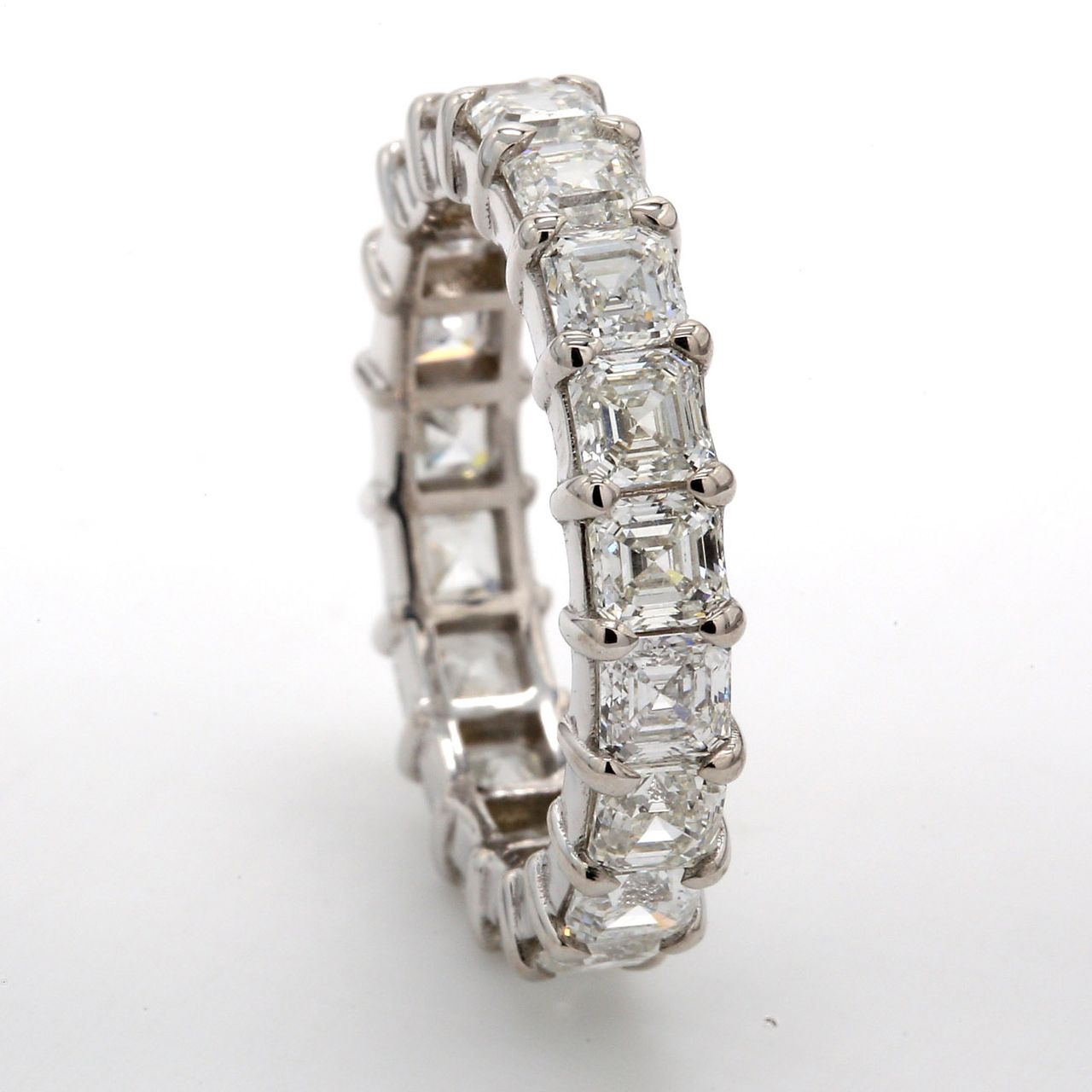 Eternity band in 18K WG with basket prong set (19) asscher cut diamonds.  D3.53ct.t.w.  Size 5