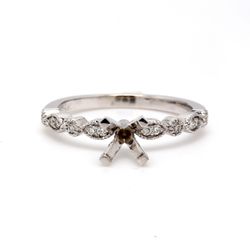 Semi-mount with shared prong set round diamonds.  D0.14ct.t.w.  Size 6.75