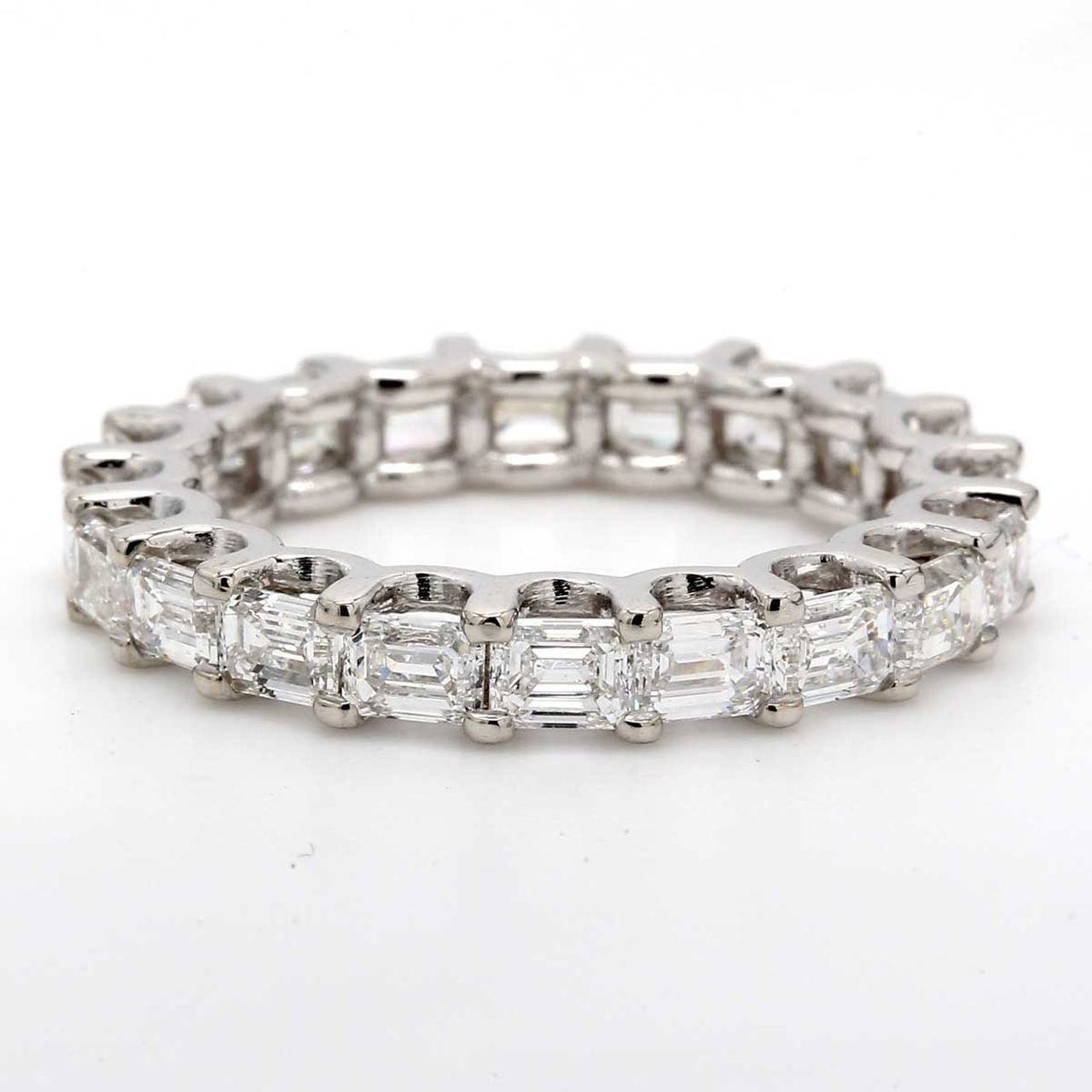East to west style eternity band with prong set (20) emerald cut diamonds.  D3.03ct.t.w.