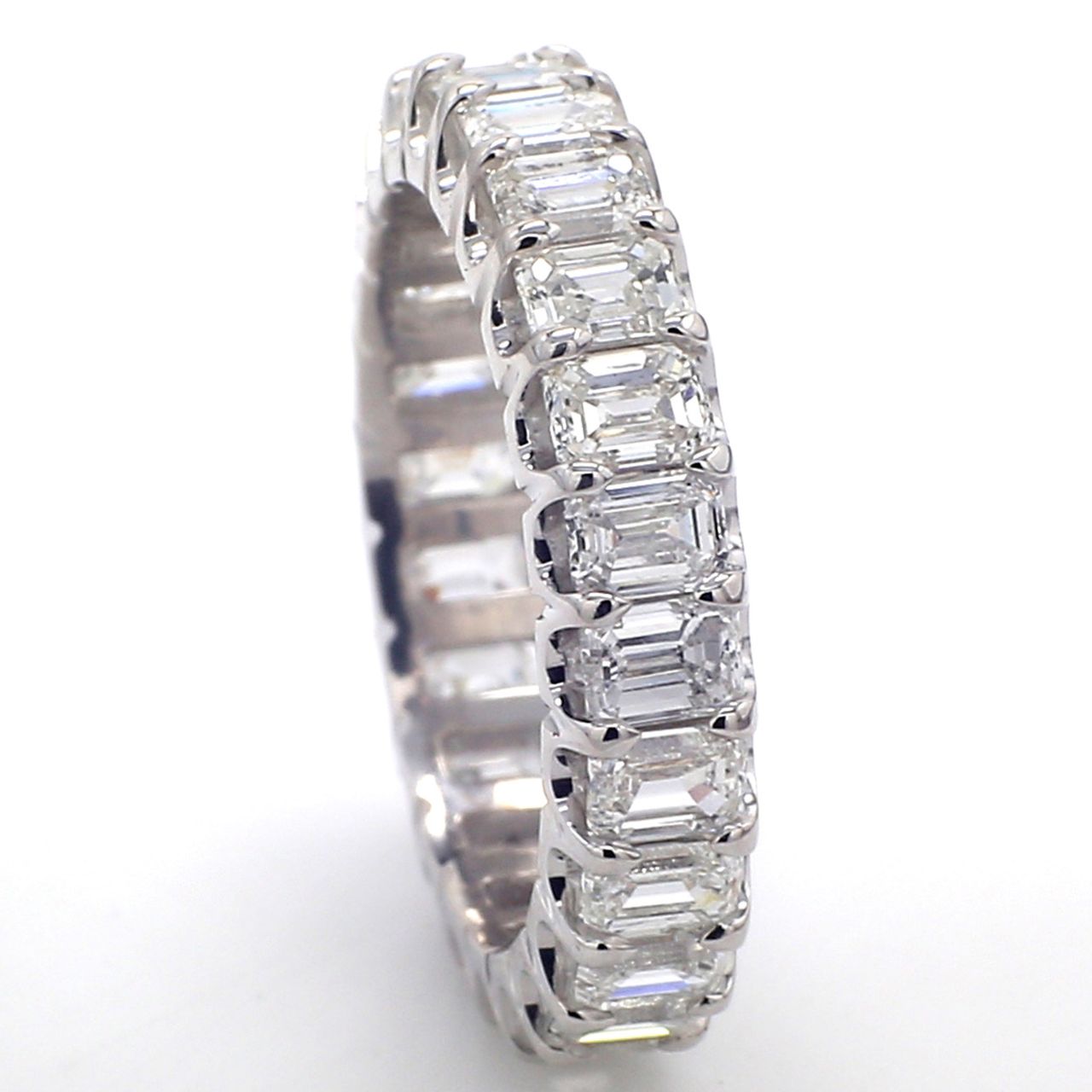Eternity band in platinum wih U-prong set (24) emerald cut diamonds.  D3.50ct.t.w.  Size 5.75