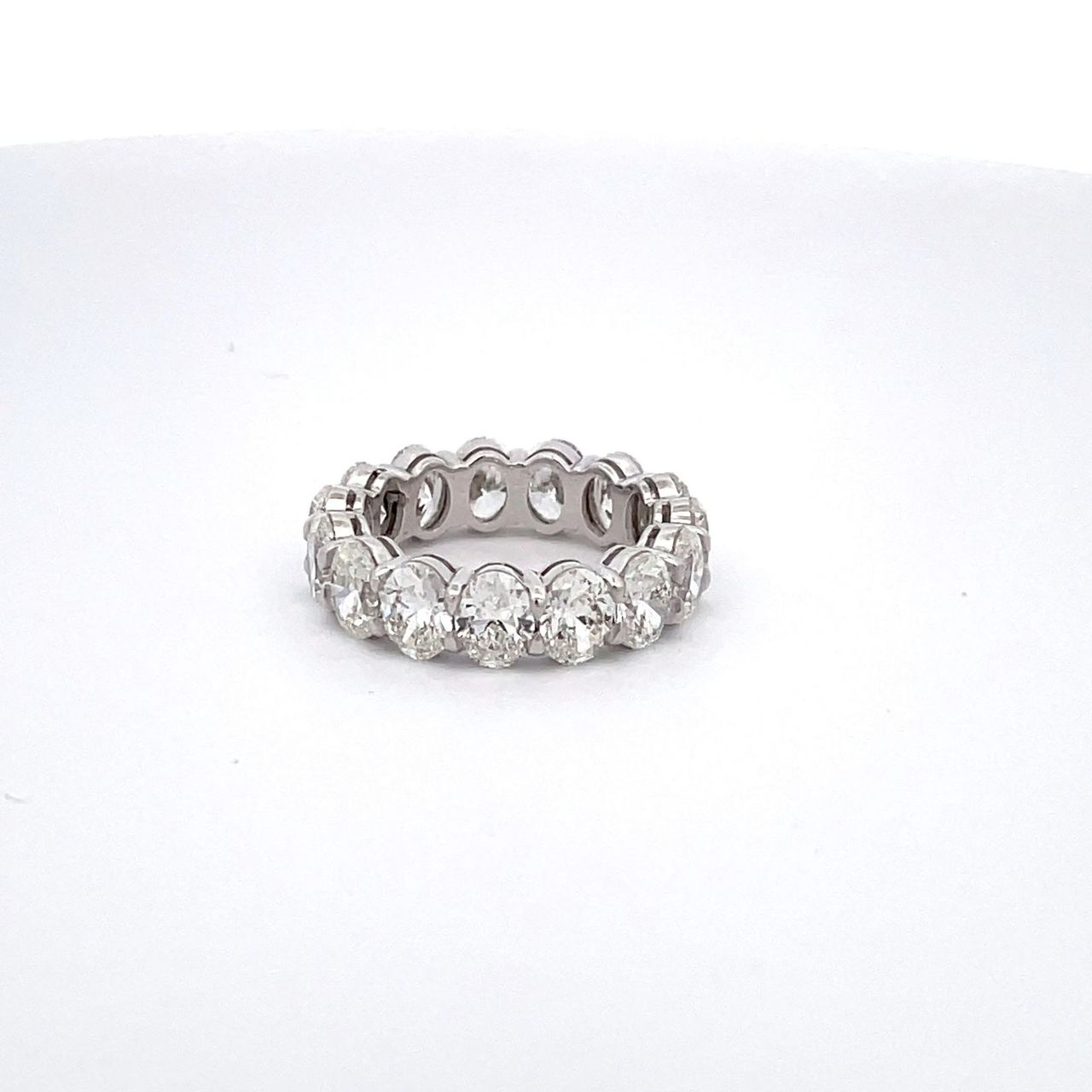 Eternity band in platinum with basket claw prong set GIA certified G-H/VS1-SI1 (15) oval cut diamonds.  D6.02ct.t.w.  Size 5.25