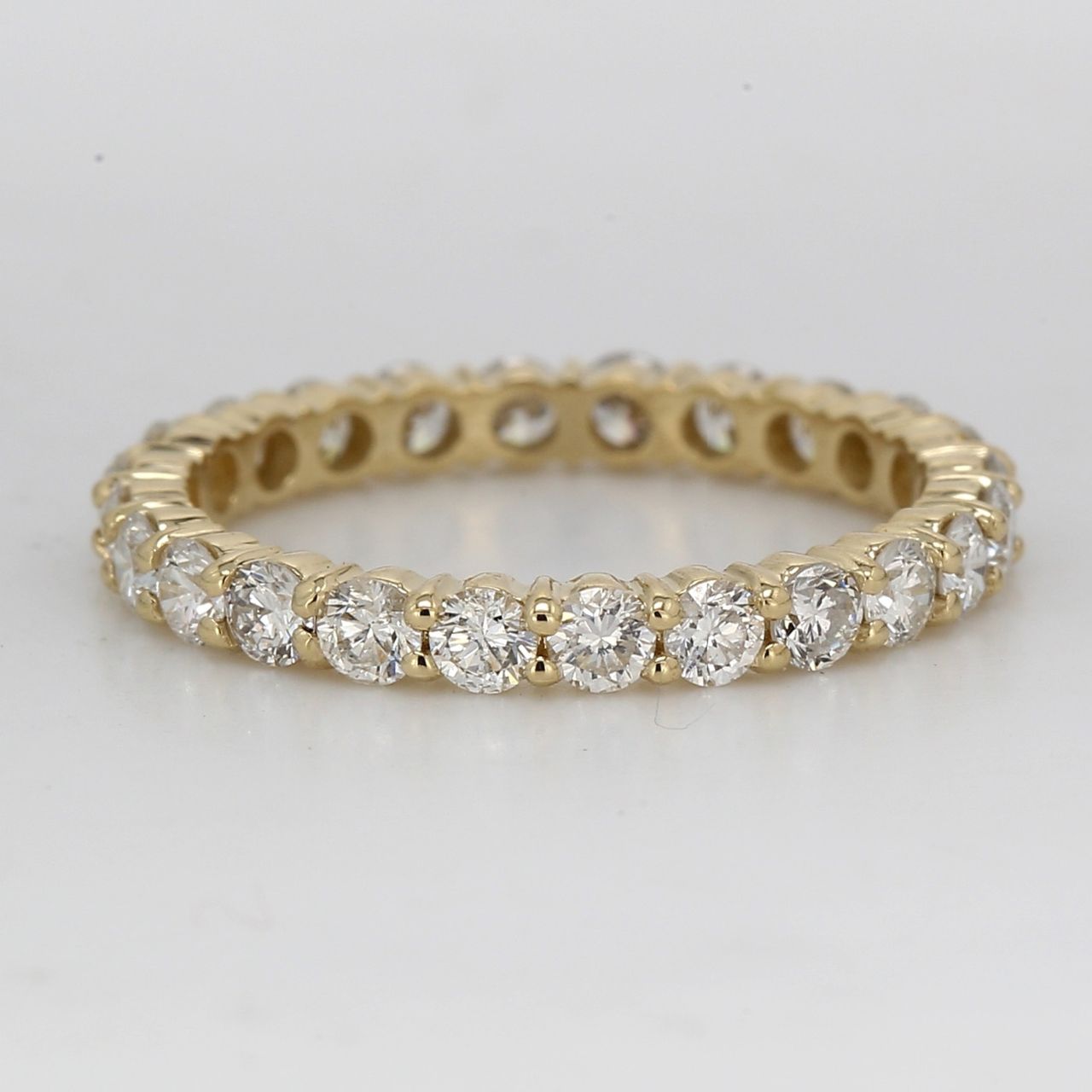 Eternity band in 14K YG with shared prong set round diamonds.  D1.09ct.t.w.  Size 4.75