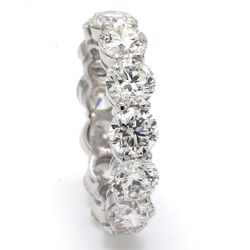 Eternity band in platinum with basket claw set G-H/VS2-SI1 (13) round diamonds.  D9.12ct.t.w.  Size 7