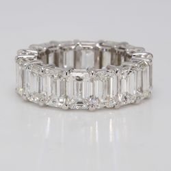 Eternity band in 18K WG with shared prong set (20) emerald cut diamonds.  D5.43ct.t.w.  Size 6