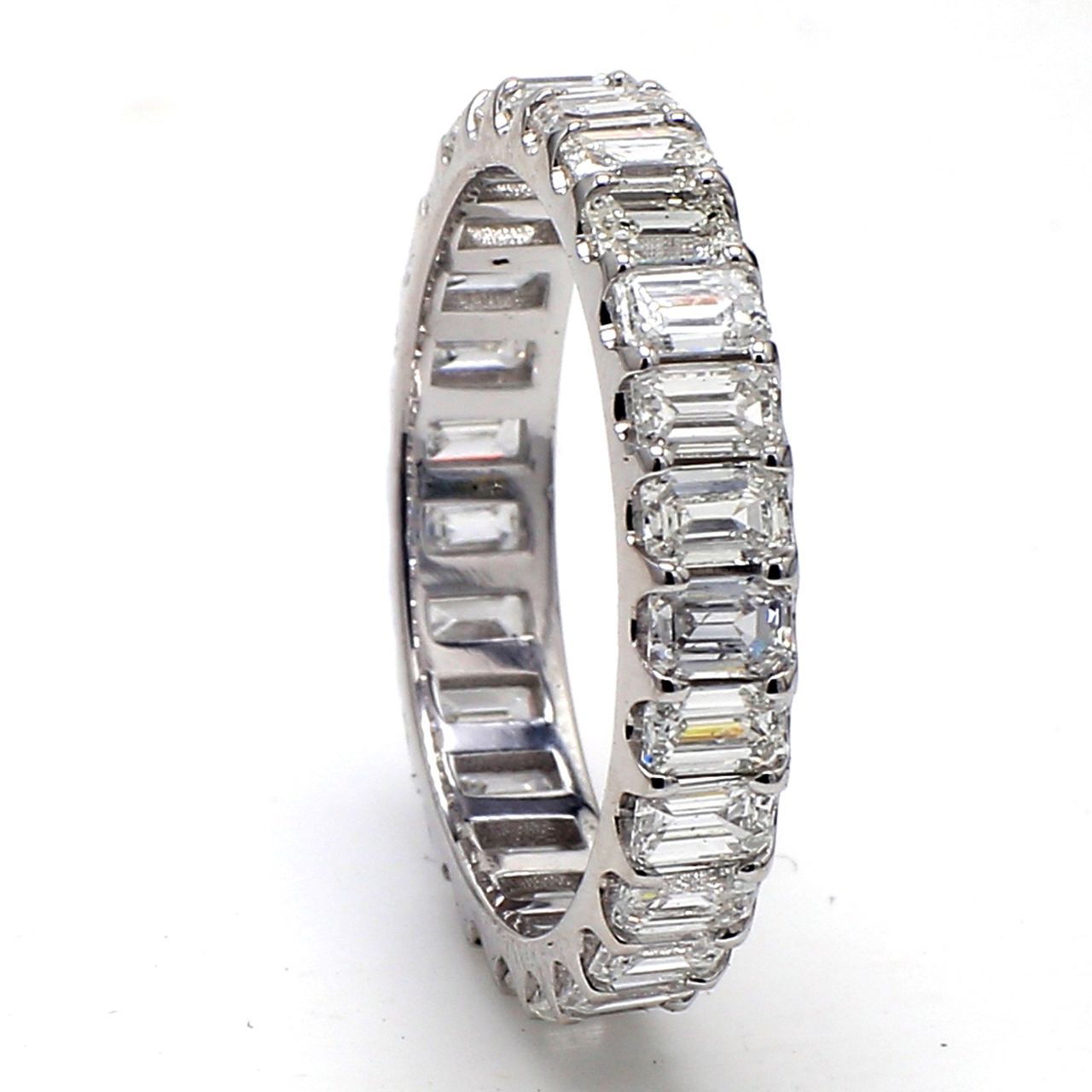 Eternity band in platinum with U-prong set (27) emerald cut diamonds.  D2.51ct.t.w.  Size 6
