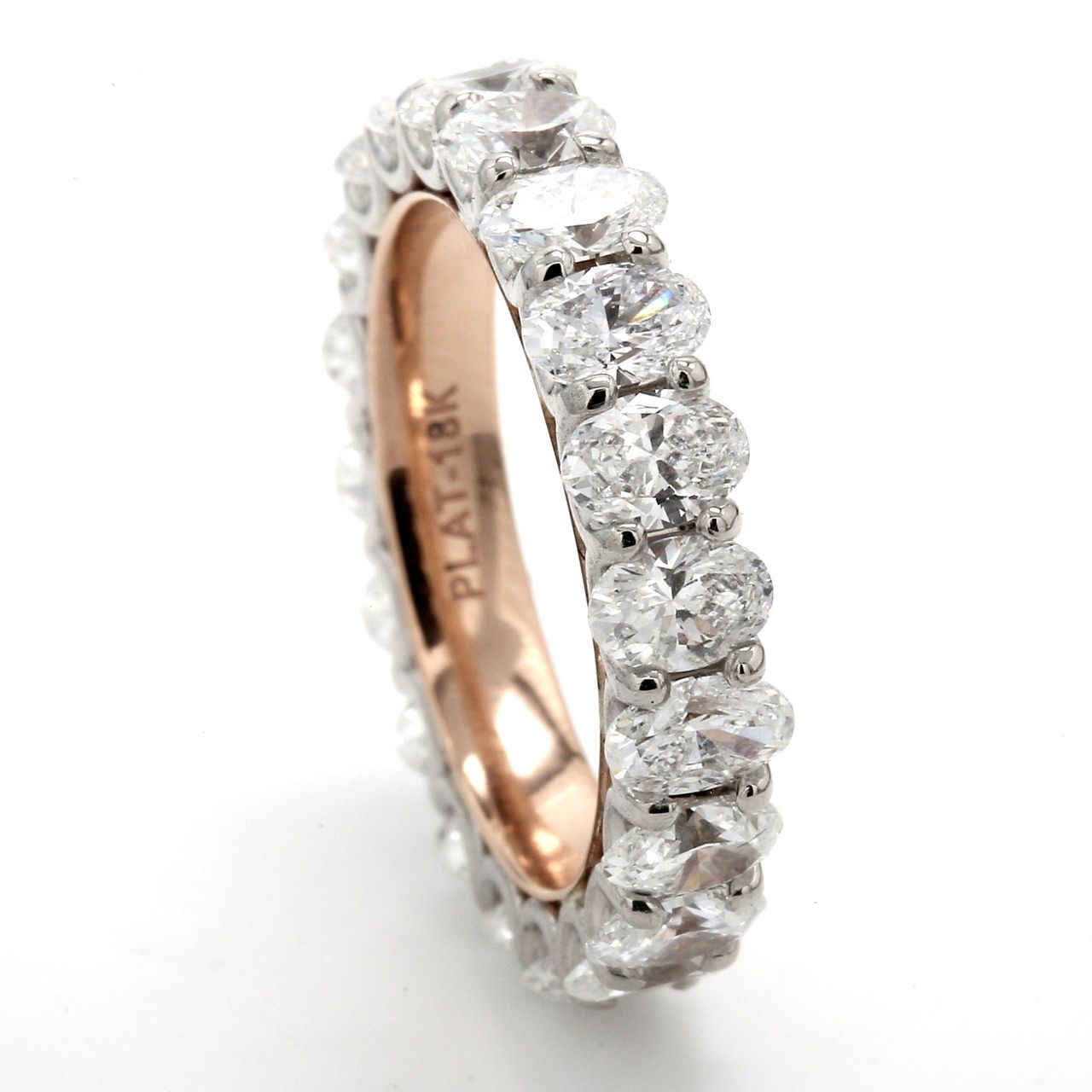 Eternity band in platinum with 18K RG comfort-fit interior with shared U-prong set (20) oval diamonds.  D3.75ct.t.w.  Size 5.5