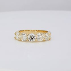 5-stone band in yellow gold with shared prong set round diamonds.  D2.06ct.t.w.