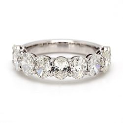 9-stone band in platinum with shared basket prong set oval cut diamonds.  D2.46ct.t.w.  Size 6