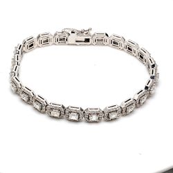 7' Halo tennis bracelet with round diamonds around (23) emerald cut diamond centers.  D6.93ct.t.w.