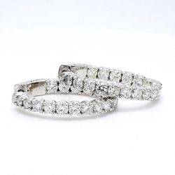 1' Oval shaped inside out hoop earrings with U-prong set round diamonds & with special spring lock.  D3.58ct.t.w.