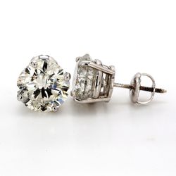 Screw back stud earrings with basket prong set USA certified F-G/SI3-I2 round diamonds.  D5.51ct.t.w.