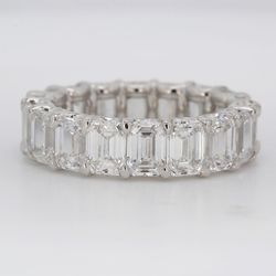Eternity band in platinum with shapred U-prong set GIA certified D-F/IF-VS2 emerald cut diamonds.  D8.43ct.t.w.  Size 6.5