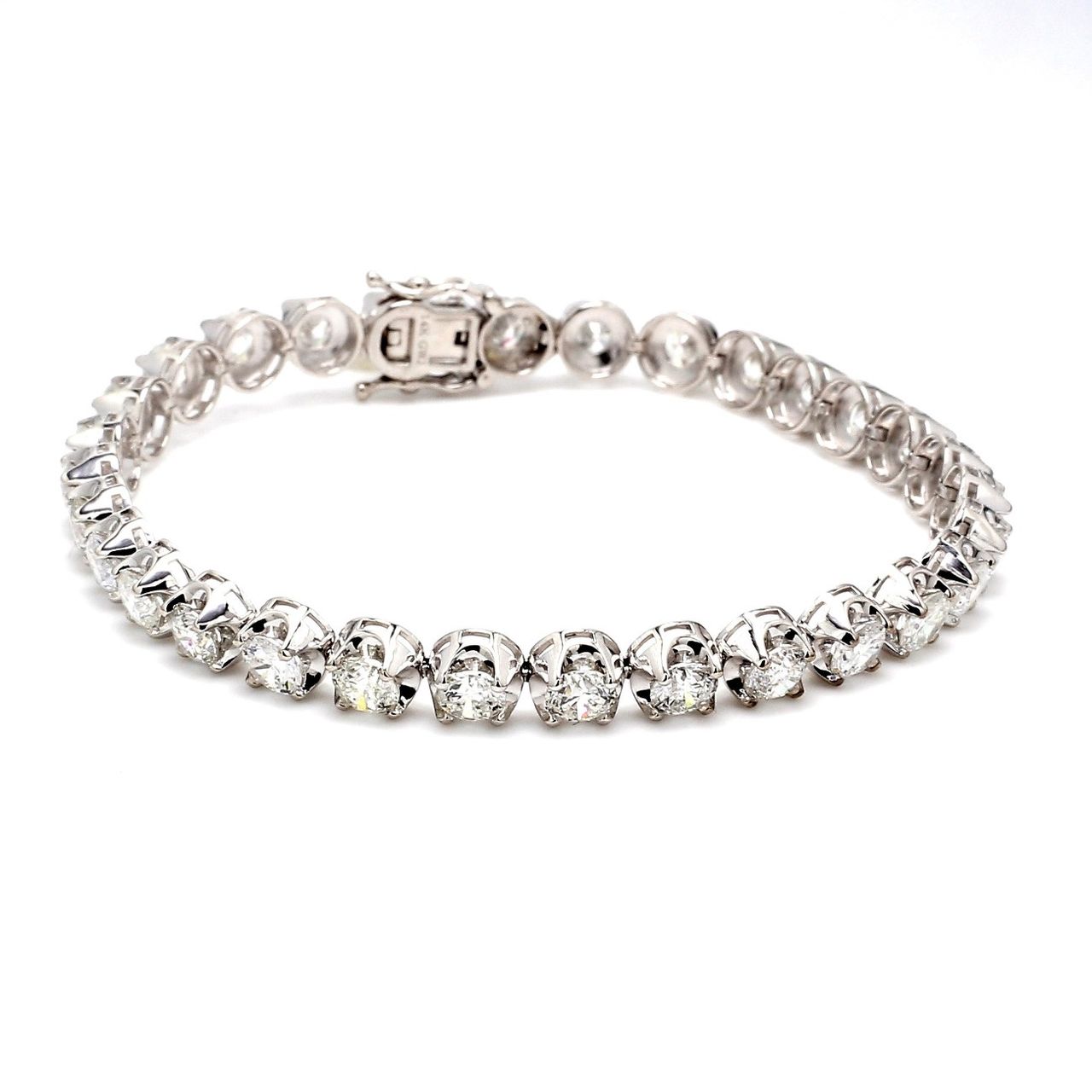 7.5' Tennis bracelet with crown head prong set (30) round diamonds.  D9.81ct.t.w.